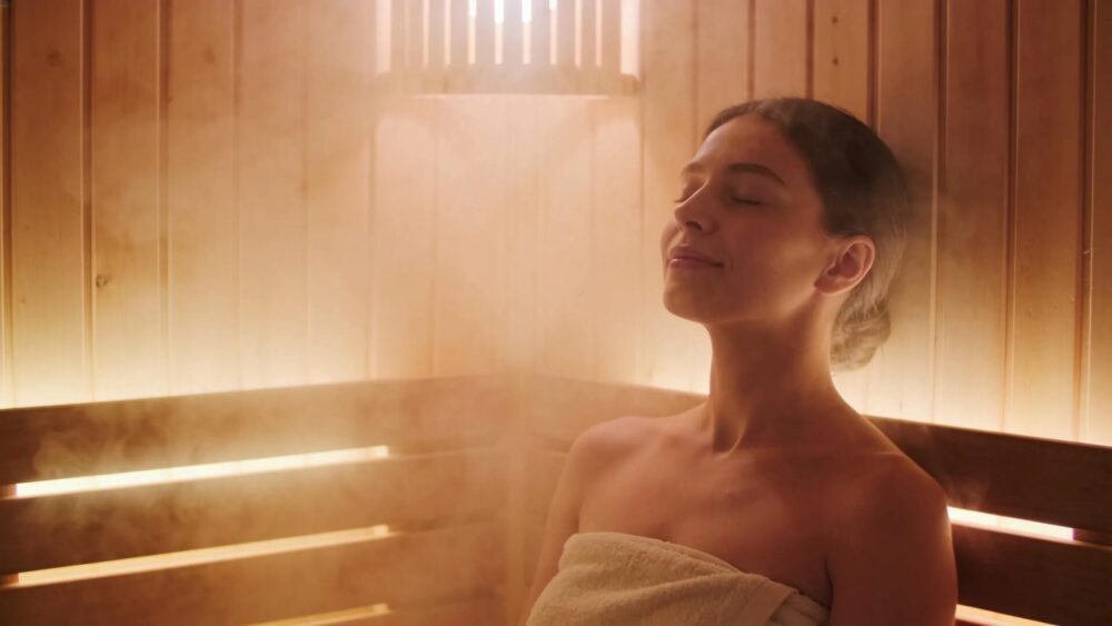 Individual relaxing in an infrared sauna, highlighting stress relief and tranquility benefits